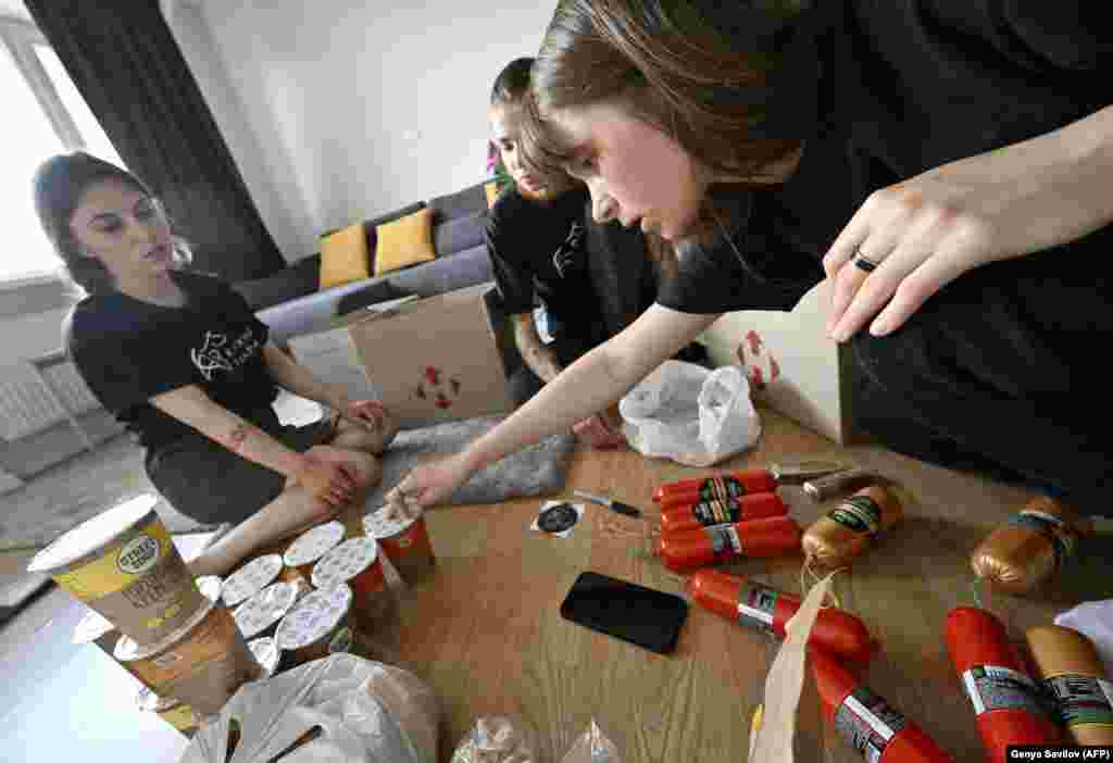 Volunteers in Kyiv in June pack plant-based products that will be sent to vegan front-line soldiers.