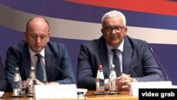 Montenegrin parliament speaker Andrija Mandic (right) attends the All-Serb Assembly in Belgrade on June 8.