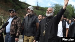 Archbishop Bagrat Galstanian leads a group of protesters who oppose border changes on a march toward Yerevan, with a target date of May 9 to reach the Armenian capital.