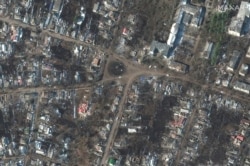 O imagine din satelit arată case și clădiri distruse, în Sumî, în data de 14 martie 2022.