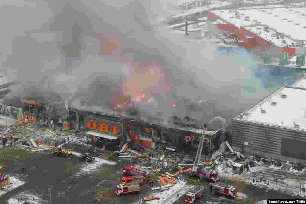 December 9: A gutted OBI home and garden retail store in northwest Moscow after a blaze destroyed the building. Amateur video shows a chain of large explosions taking place during the blaze in which one person was killed. 