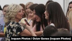 Jull Biden meets with Ukrainian refugees in Romania on May 7.