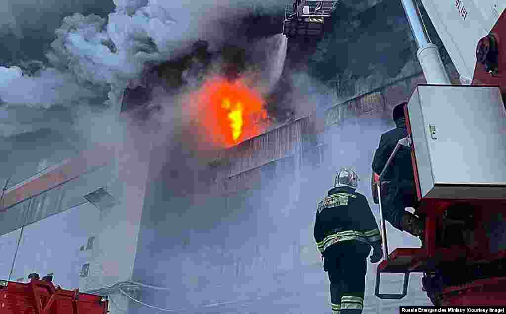 December 9: Firefighters during a blaze at a tire production factory in Barnaul in southern Russia. Local reports suggest the factory would be out of action for around six months. The 1,200 people who worked at the plant have been placed on leave. 