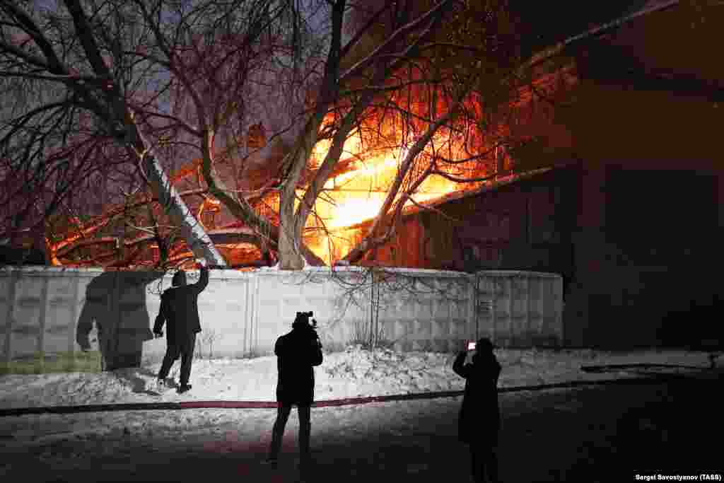 November 20: People film a fire as it engulfs a warehouse in central Moscow. Two bodies were later found in the wreckage of the building. Local reports claim an explosion took place during the blaze. 
