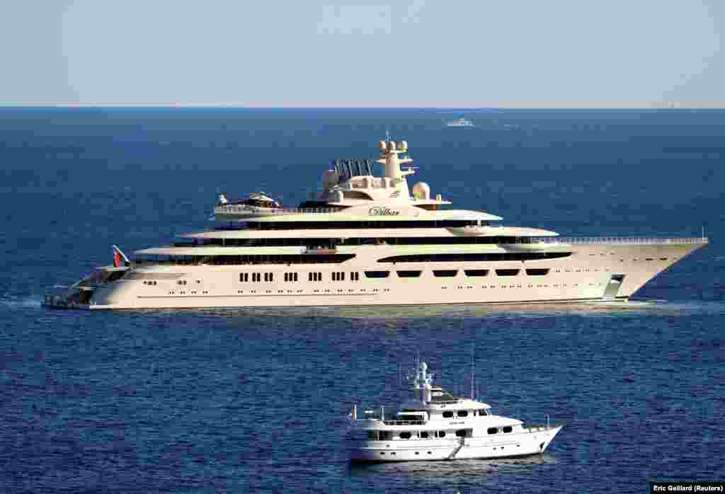 The 156-meter-long Dilbar, seen here off the cost of Monaco in 2017, is estimated to be worth $594 million, according to the Bloomberg Billionaires Index. Owned by Russian billionaire Alisher Usmanov, it cannot leave the port of Hamburg. Initial reports said it was seized, but others say sanctions prevent the paying of the crew and German authorities have not issued a customs document allowing for its departure. With holdings in mining, media, and telecoms, Usmanov is seen as closely linked to President Putin. Usmanov issued a statement on March 1 saying that the sanctions were based on "false and defamatory allegations damaging my honor, dignity, and business reputation. I will use all legal means to protect my honor and reputation."