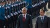 Albanian Prime Minister Edi Rama (L) and his Serbian counterpart Aleksandar Vucic inspect the honour guard during an official welcoming ceremony in Belgrade November 10, 2014. Albanian Prime Minister Rama became the first Albanian leader to visit Serbia s