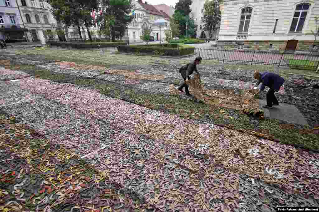 Handmade camouflage netting laid out in a courtyard in Lviv in September. 