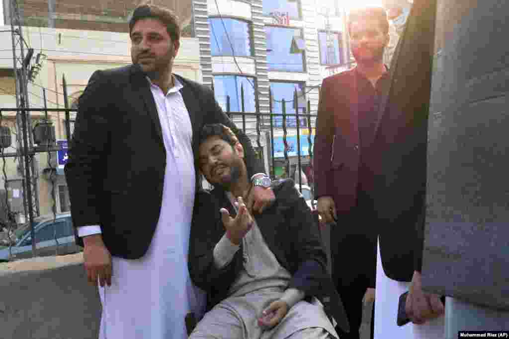 While another man mourns a family member who was killed in the bombing. 