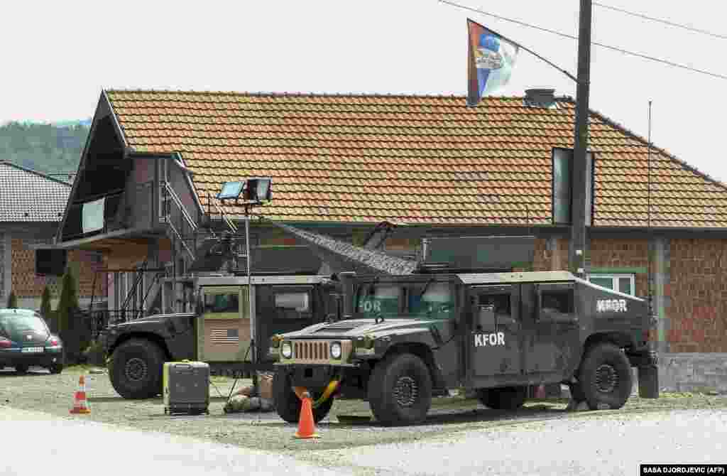 American Humvees from the NATO-led peacekeeping mission in Kosovo patrol near Leposavic on September 1. U.S. NATO peacekeepers were seen in force on the streets of northern Kosovo on September 1 as tensions reemerged in the region over a countdown announced for the enforcement of car license-plate requirements. 