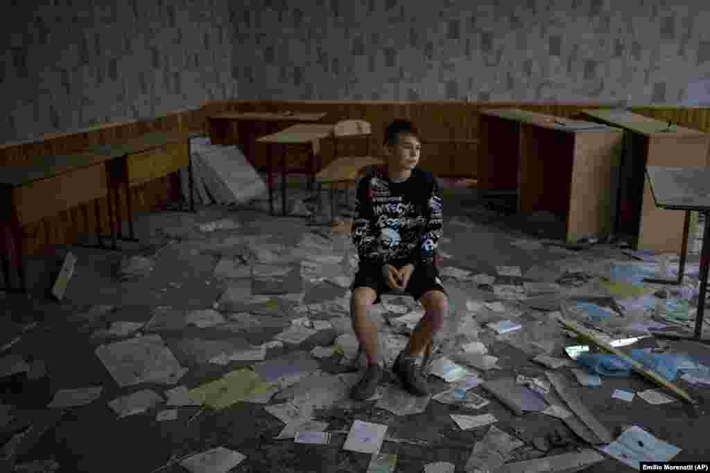 "When I'm in my classroom, I think about how much I want the war to end," said Oleksandr Morhunov, 13, sitting in his old classroom.