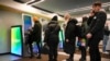 Russia Ukraine Invasion -- People stand in line to withdraw money from an ATM in Sberbank in St. Petersburg, Russia, Friday, Feb. 25, 2022.
