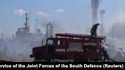 Firefighters work at a site of a Russian missile strike at the sea port of Odesa on July 23.