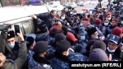 Armenia - Riot police detain opposition activists outside the parliament building in Yerevan, February 3, 2021.