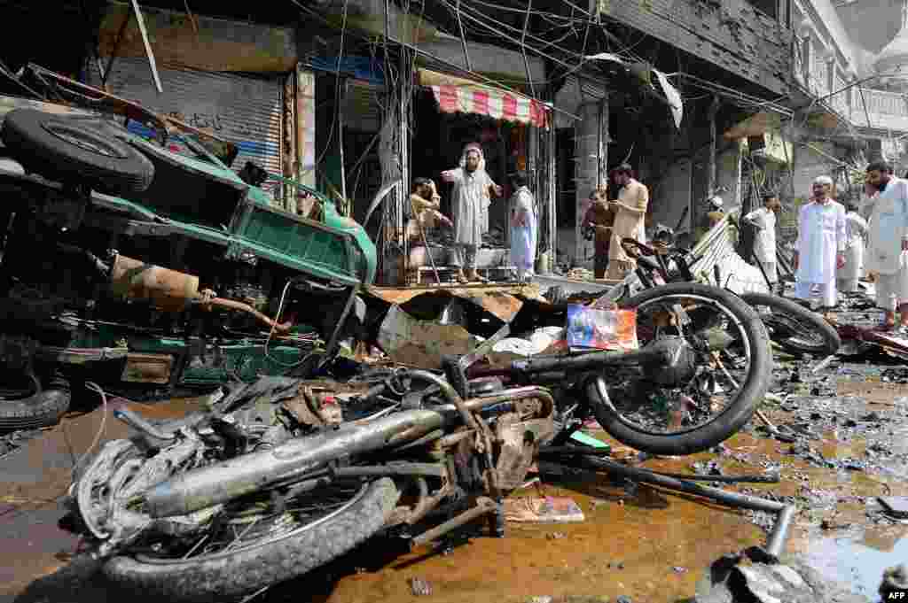 Shop owners survey the damage.