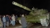 A Lithuanian demonstrator stands in front of a Soviet Army tank during the assault on the Lithuanian Radio and Television station in Vilnius on January 13, 1991. 