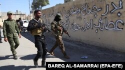 Critics say the move to bring Hashd al-Shaabi militia from Iraq is a show of force by Iran's Islamic Revolutionary Guards Corps amid discontent over what is seen as Tehran's poor response to devastating floods. (file photo)