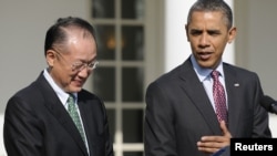 U.S. President Barack Obama (right) introduces Jim Yong Kim as his nominee to be the next president of the World Bank.