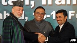 Pakistani President Asif Ali Zardari is flanked by his Afghan and Iranian counterparts, Hamid Karzai (left) and Mahmud Ahmadinejad, after a joint press conference in Islamabad in February.