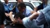 Armenia - Hayk Kyureghian is overpowered by police officers after firing gunshots outside a court in Yerevan, 12Jun2014.