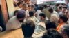 People carry the coffin of former Senator Hidayatullah Khan to an ambulance after he was killed in a bomb explosion in the Bajaur district of Pakistan's Khyber Pakhtunkhwa Province on July 3.