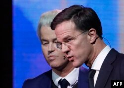 Прем’єр-міністр Нідерландів Марк Рютте (п) та лідер Парітї Свободи Ґерт Вілдерс на дебатах у Роттердамі, 13 березня 2017 року