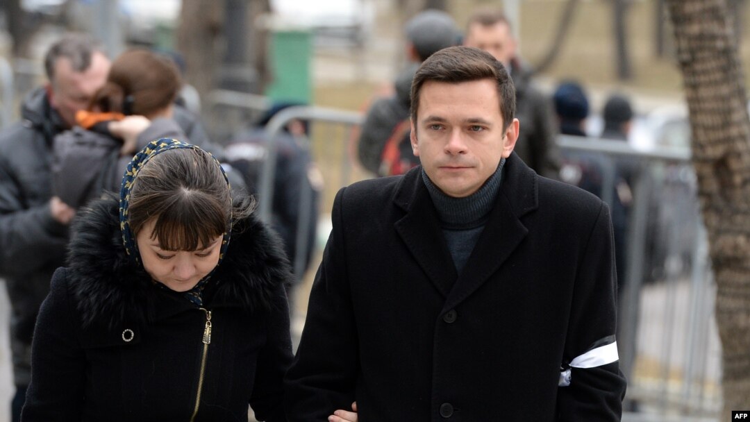 Russian opposition activist Ilya Yashin (right) arrives to attend a farewell ceremony for Nemtsov in Moscow on March 3.
