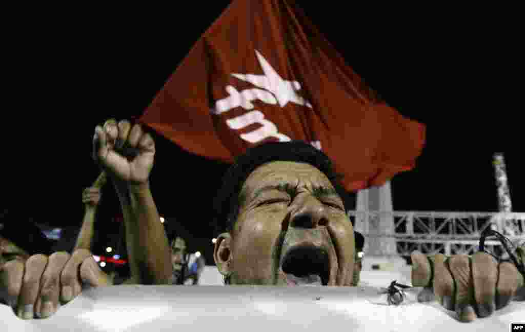 El Salvador - Reakcija pripadnika političke partije FMLN na Chavezovu smrt, San Salvador, 5. mart 2013. Foto: AFP / Marvin Recinos