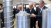 Iranian President Masud Pezeshkian (second right) and Atomic Energy Organisation of Iran chief Mohammad Eslami (right) are pictured at an event for Iran's Nuclear Technology Day in Tehran on April 9.