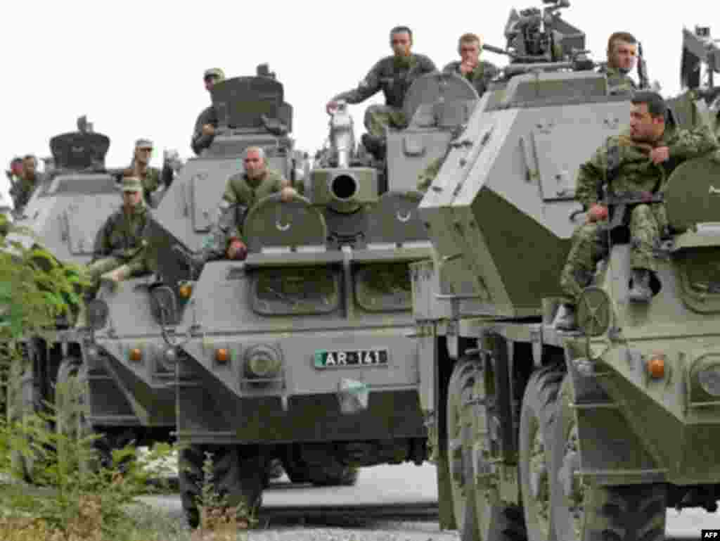 Georgian troops on armored personnel carriers enter South Ossetia. Earlier today, Georgia said its soldiers had seized the "greater part" of the breakaway province after heavy fighting erupted overnight.