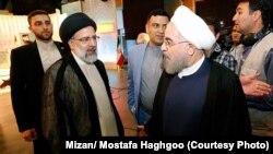 حسن روحانی (راست) و ابراهیم رئیسی در یکی از مناظرههای انتخابات ریاستجمهوری سال ۱۳۹۶