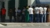 People wait in long lines to withdraw cash from an ATM machine in Ashgabat earlier this month.