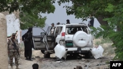 Pakistani security officials examine the site of a powerful explosion in Mastung district, east of provincial capital Quetta, in the southwestern province of Balochistan in May.