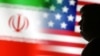 Illustration of a 3D-printed miniature model of U.S. President Donald Trump and the U.S. and Iran flags
