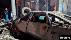 Theftermath of a Russian missile strike in Kryviy Rih that killed at least one person on December 24.