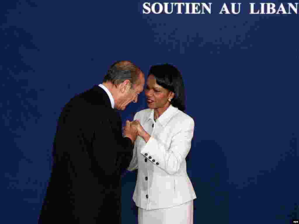 France -- President Jacques Chirac (L) greets US Secretary of State Condolezza Rice at the Conference for Support on Lebanon in Paris, 25Jan2007