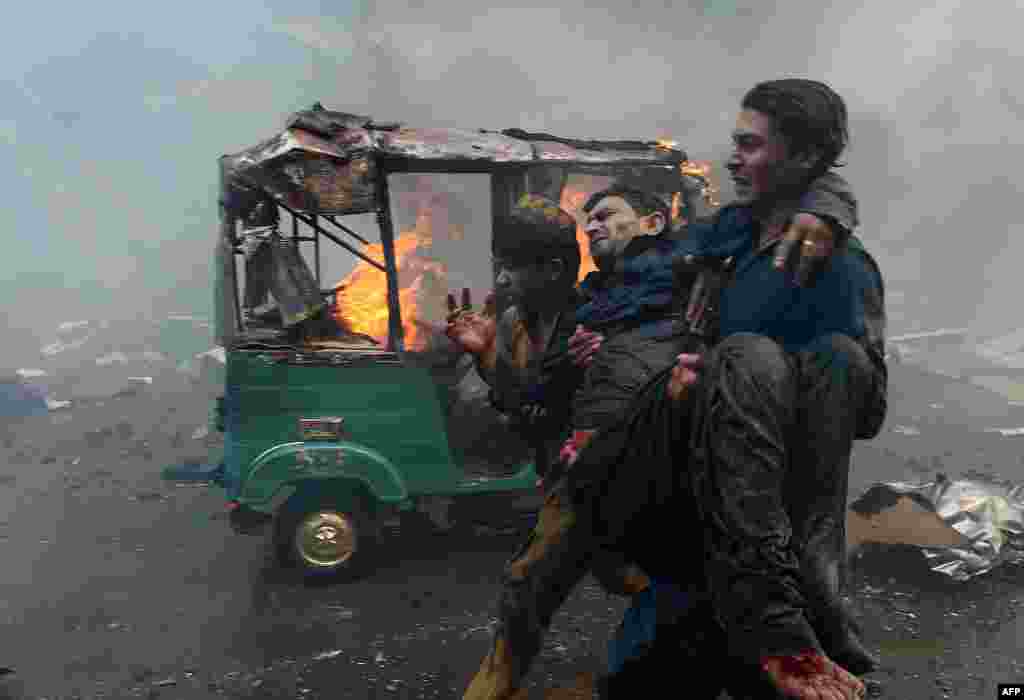 With ambulances slow to respond, many of those injured in the blast had to be carried out by rescue workers and local residents.
