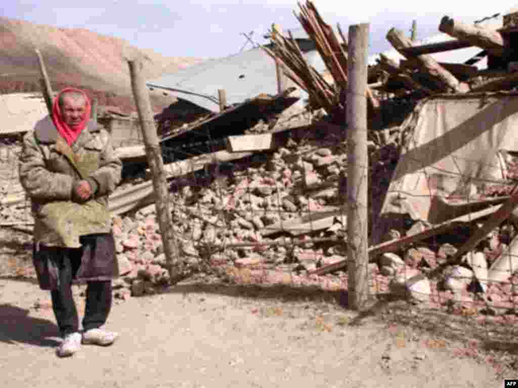 A man stands near a house in Nura destroyed by the 6.6-magnitude earthquake. - KYRGYZSTAN, NURA : A Kyrgyz man stands near a destroyed house at the site of a major earthquake in Nura on October 6, 2008. Rescuers raced to reach a remote village in Kyrgyzstan on Monday after a strong earthquake killed at least 72 people in a mountainous area near the border with China, officials said. The quake late Sunday, which measured magnitude 6.6 according to the US Geological Survey (USGS), razed the village of Nura in the isolated Alaisky district, high in the Tian Shan mountain range