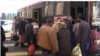 Armenia - Ethnic Armenian refugees board a bus in Yerevan that will transport them back to Nagorno-Karabakh, November 14, 2020.