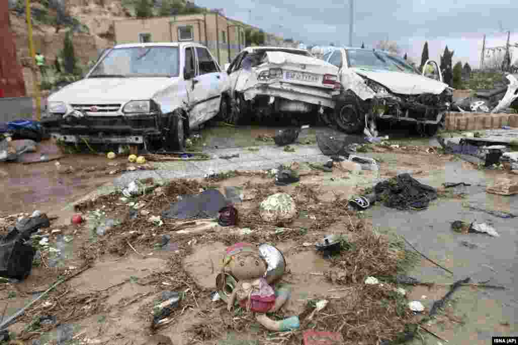 A child's toy and destroyed cars in Shiraz.