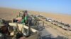 An Afghan army exercise in a rural district of Kandahar on August 17.
