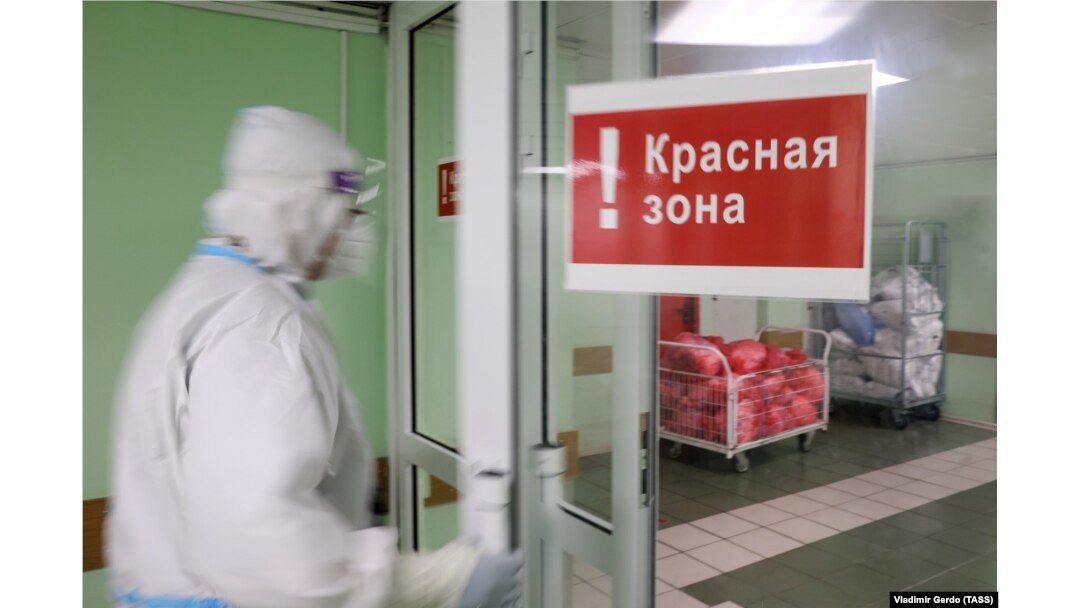 A health-care worker enters the red zone at a Moscow hospital for COVID patients.