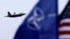 A U.S. Air Force F-22 Raptor fighter flies over the military air base in Siauliai, Lithuania.