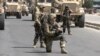 FILE: NATO troops on a street in the Afghan capital Kabul after a Taliban suicide attack on NATO convoy wounded three civilians in September 2017.