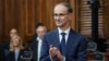 Serbian Prime Minister Djuro Macut smiles after his swearing-in ceremony at the parliament in Belgrade on April 16. 
