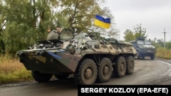Українські військовослужбовці біля селища Козача Лопань, звільненого напередодні ЗСУ від російської армії. Харківщина, 16 вересня 2022 року