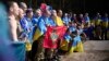 Ukrainians pose for a photo after being released in a prisoner exchange at an undisclosed location in Ukraine on September 14.