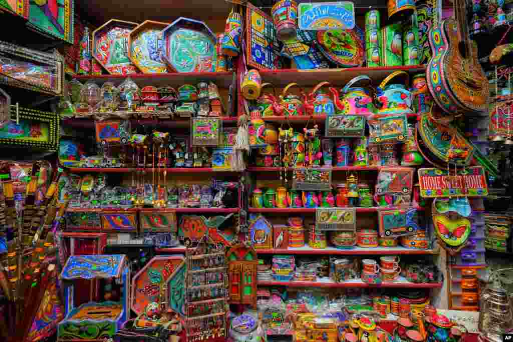 Various household decorative items are displayed for sale at a shop in the Pakistani capital, Islamabad.