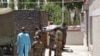 Indian army soldiers carry the body of their colleague, who was killed in a border clash with Chinese troops, to an autopsy centre at the Sonam Norboo Memorial Hospital in Leh, the capital of Ladakh on June 17.