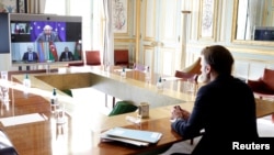Armenia - French President Emmanuel Macron holds a video conference with Armenian Prime Minister Nikol Pashinian, Azerbaijani President Ilham Aliyev and European Council President Charles Michel, February 4, 2022.