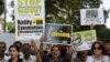 FILE: Pakistani human rights activists carry placards and banners during a protest to mark the International Day of the Victims of Enforced Disappearances in Karachi on August 30 2016.